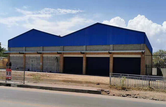 Здание магазина полуфабрикат металла склада хранения фермы стальной структуры Prefab мастерской строя стальное в Ботсване